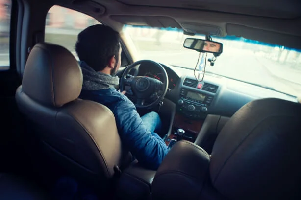 Comparison between Executive Black Limo and Uber services in Ontario, highlighting luxury and professional chauffeur experience.